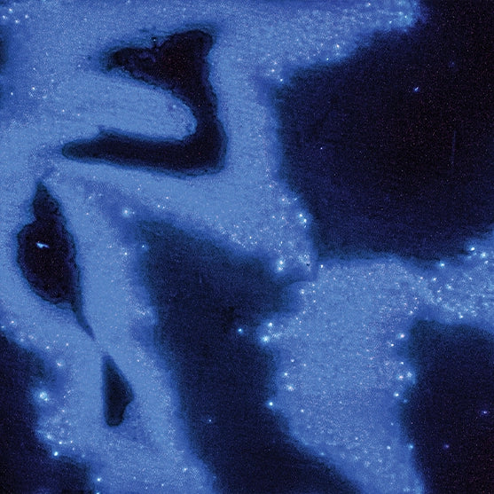 Inky blue abstract image evoking cosmic calm—used to represent the Stillness scent mood from Looking for Each Other’s fragrance experience guide.