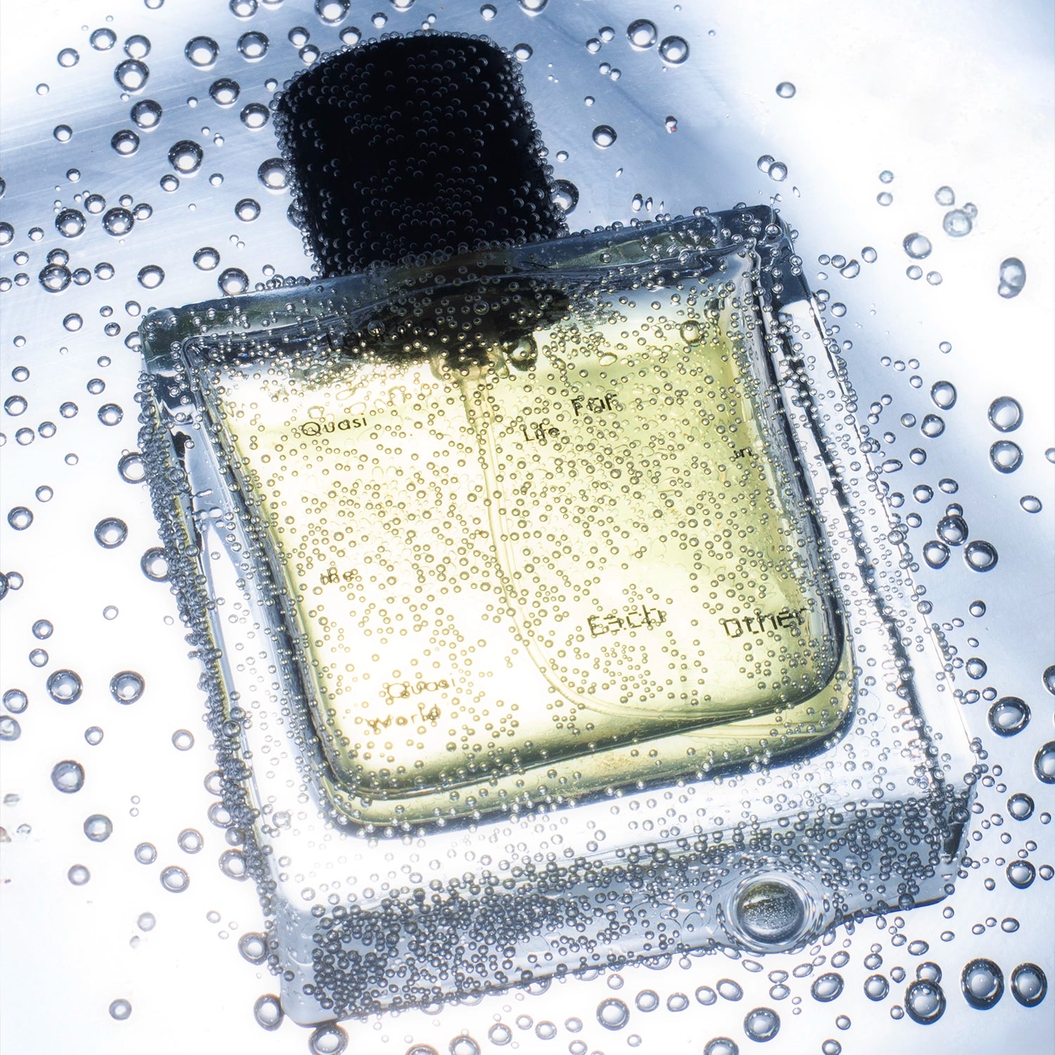 Looking for Each Other – Quasi Life in the Quasi World perfume bottle submerged underwater, surrounded by tiny rising air bubbles; dreamy, effervescent shot capturing light play on glass and liquid.