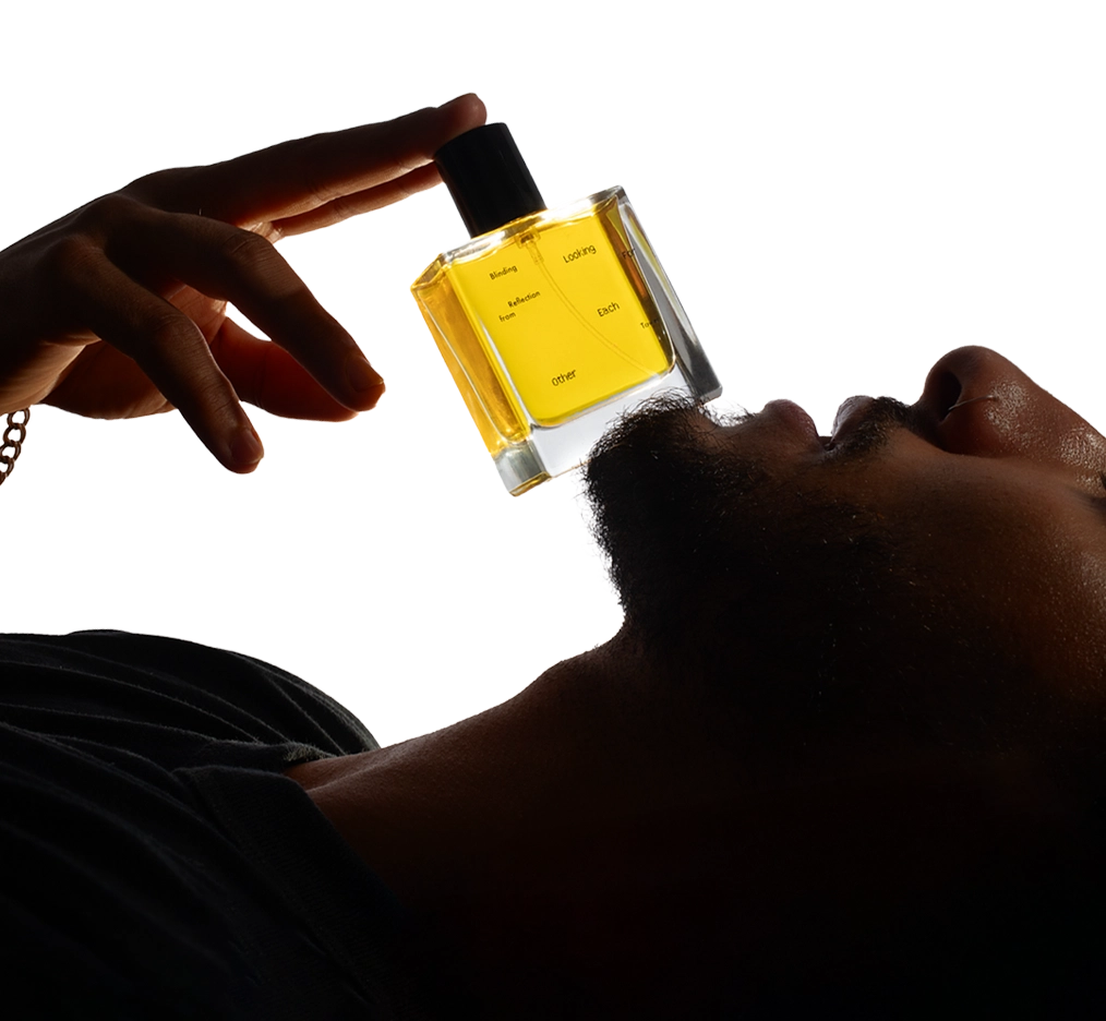 A hand holding a 50ml bottle of Blinding Reflection from Tower Window by Looking for Each Other against a white backdrop. The image highlights the brand’s minimal design and commitment to 100% botanical ingredients.