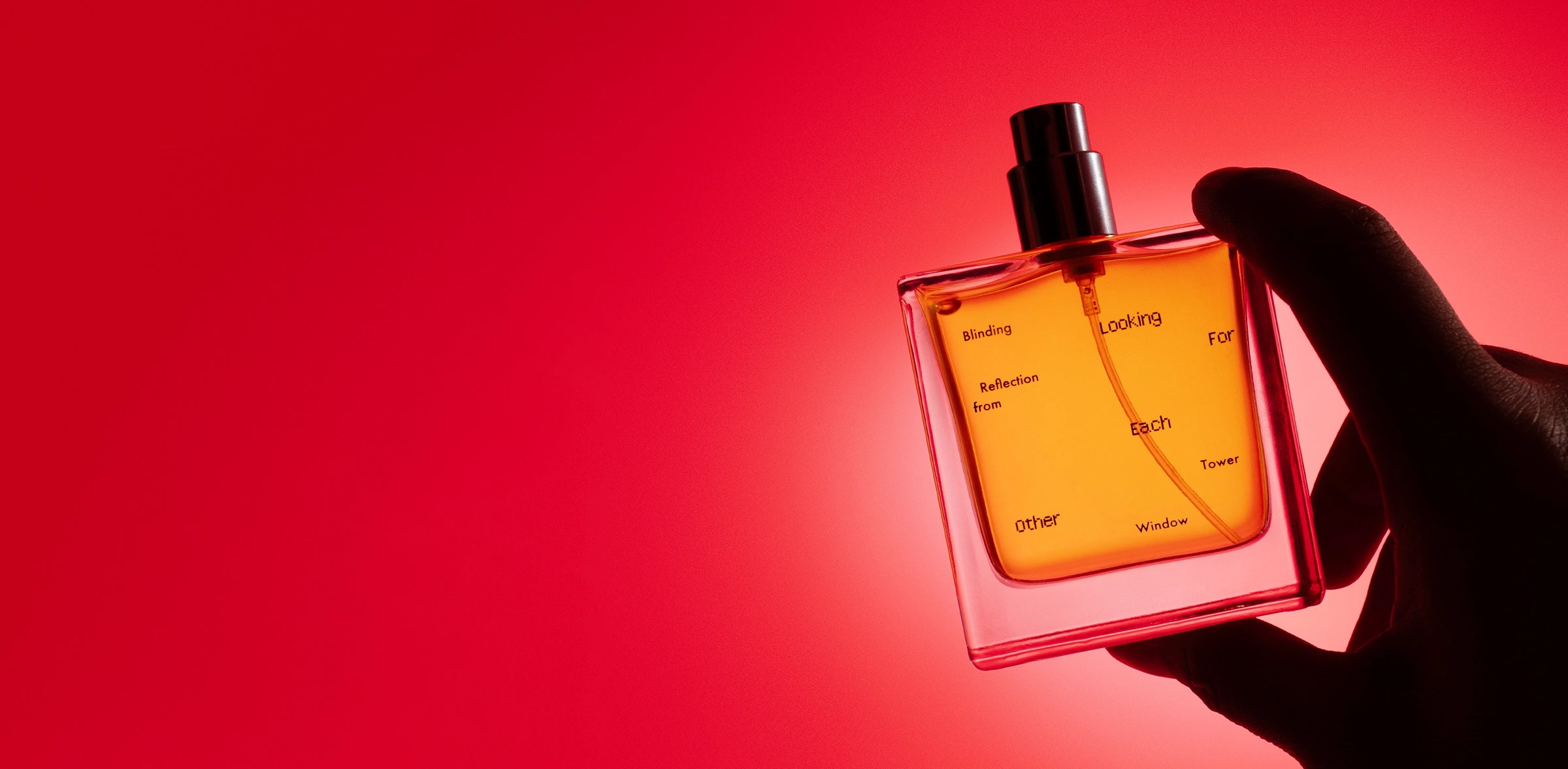 Blinding Reflection from Tower Window by Looking For Each Other — all-natural botanical perfume in a hand silhouetted against a vivid red gradient background.